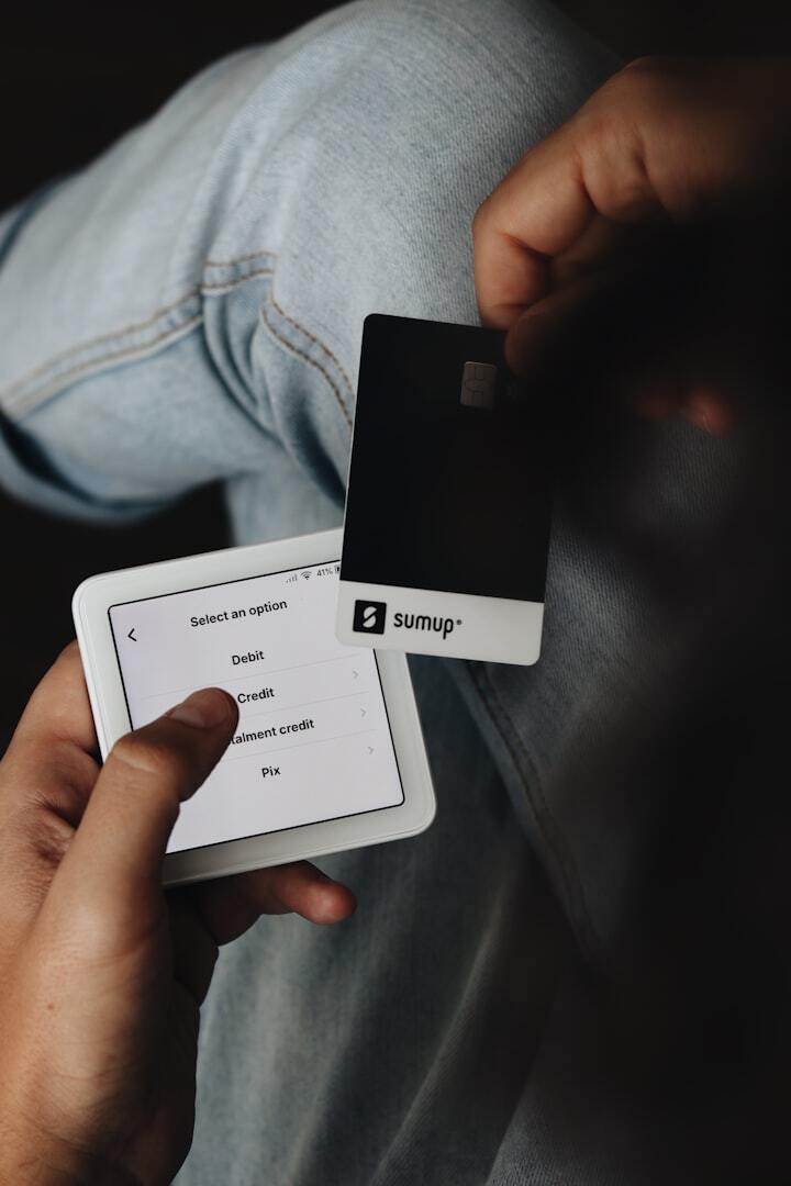 A-person-holding-a-tablet-and-a-credit-card